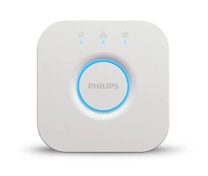 The white square Philips Hue Bridge hub with its status lights glowing blue